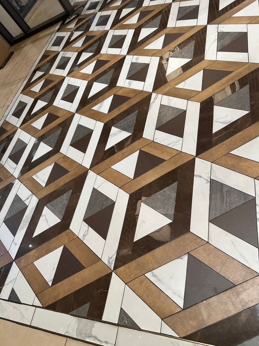 Waterjet-cut porcelain pattern floor in a commercial space