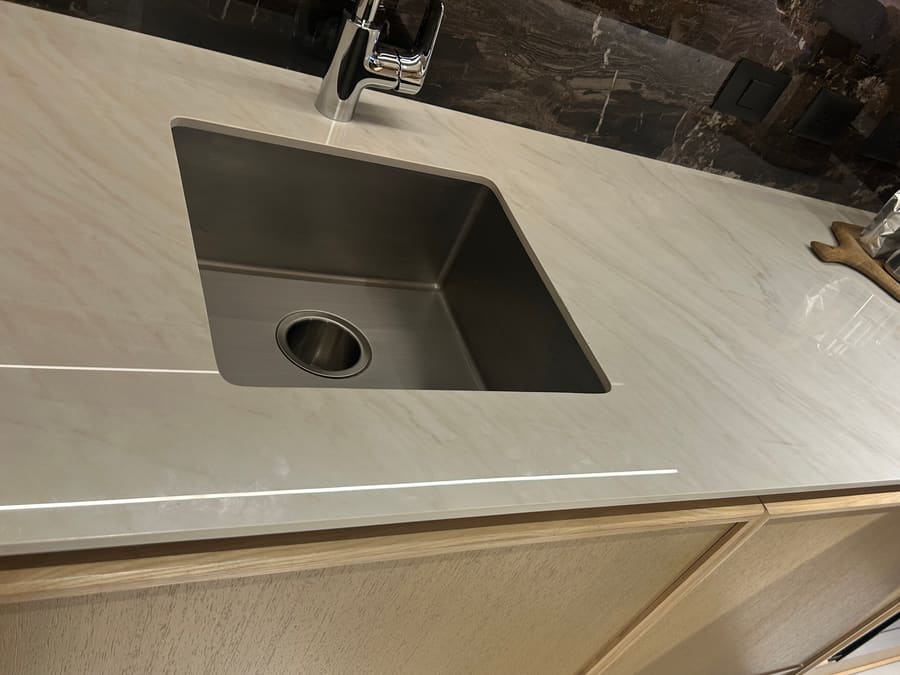 Porcelain slab counter with sink cutout and mitred edge detail